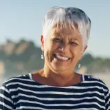 Smiling woman featured with a residential pest control testimonial